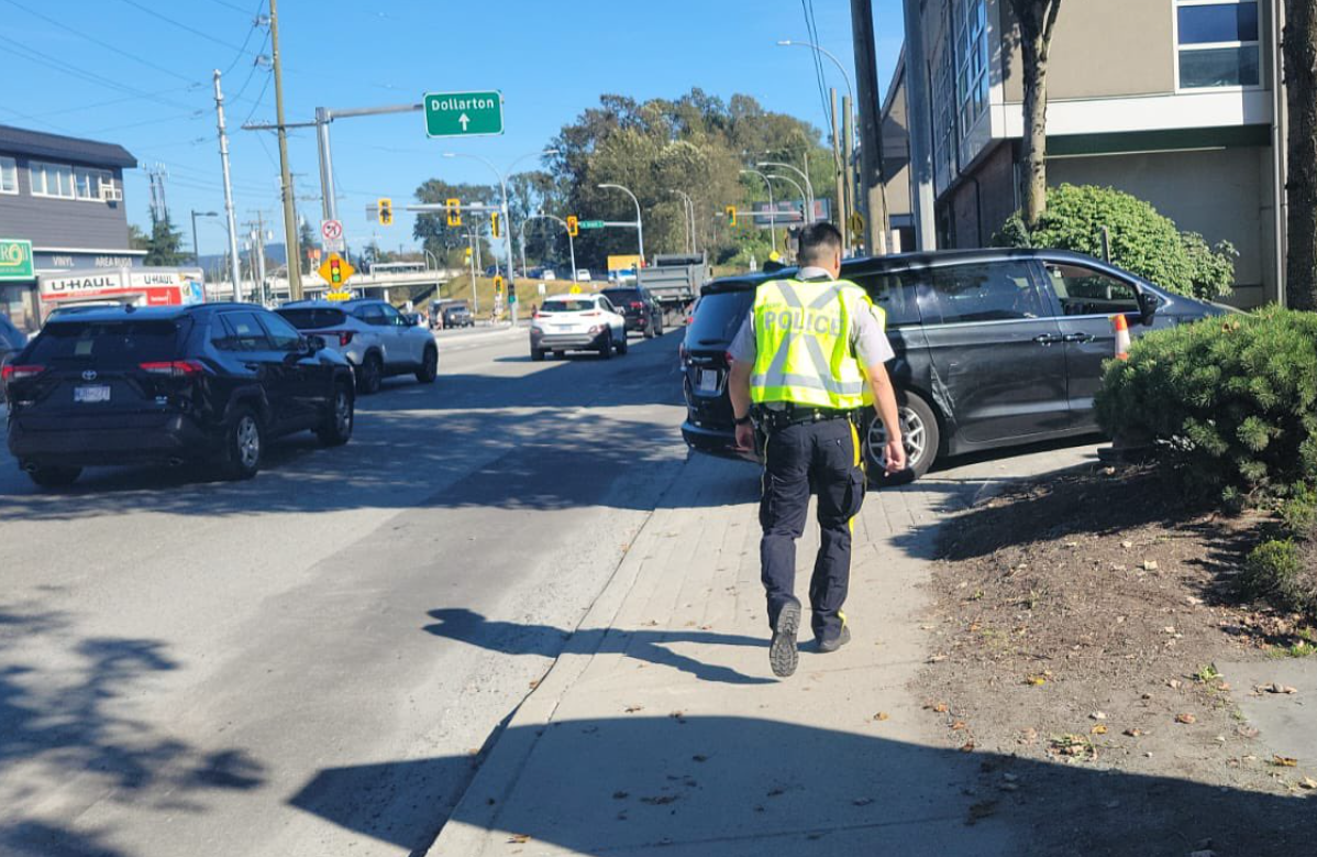North Van officer walking on streets.
