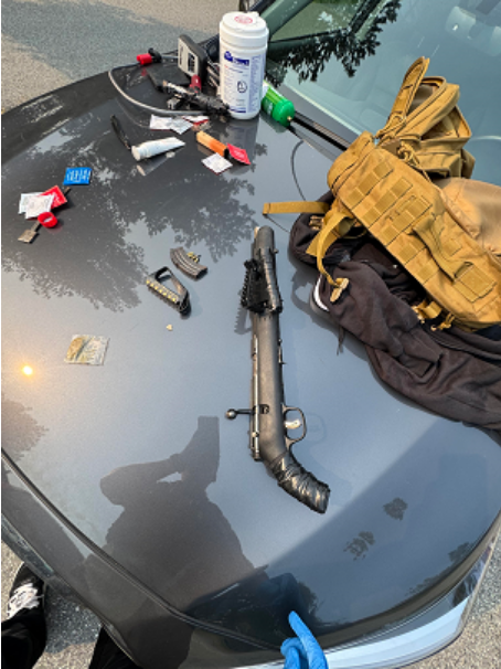 THe loaded firearm among other items